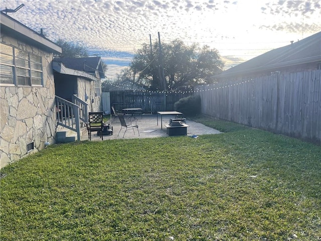 view of yard with a patio and a fenced backyard