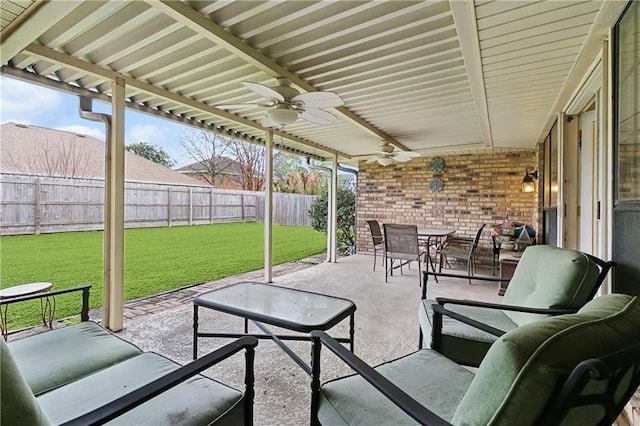 view of patio / terrace featuring an outdoor hangout area, a fenced backyard, a ceiling fan, and outdoor dining space