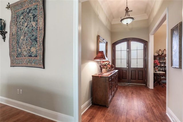 entrance foyer with baseboards, dark wood-style flooring, french doors, and crown molding