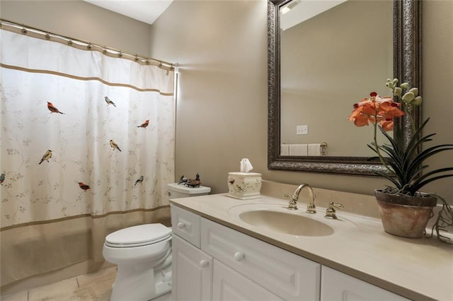 full bath featuring a shower with shower curtain, tile patterned floors, vanity, and toilet