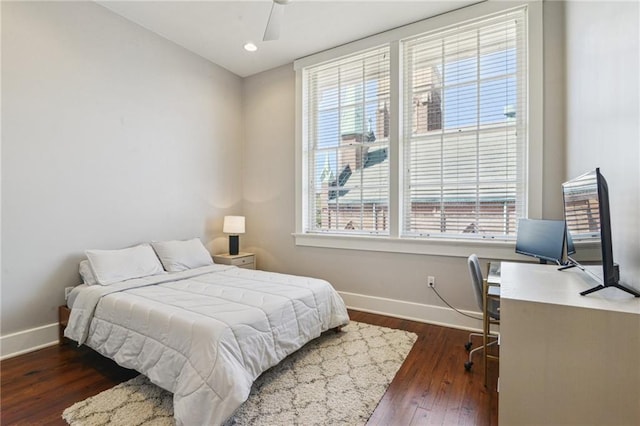 bedroom featuring recessed lighting, baseboards, wood-type flooring, and a ceiling fan