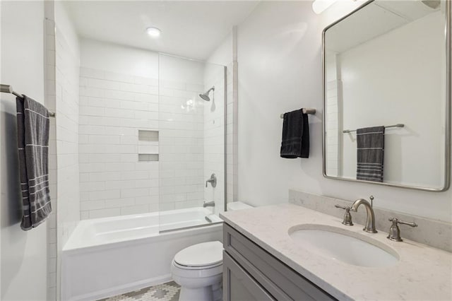 full bath featuring tub / shower combination, toilet, and vanity