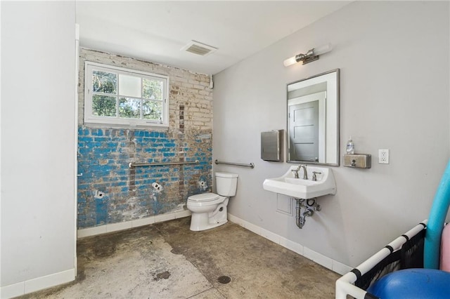 bathroom with toilet, baseboards, visible vents, and a sink