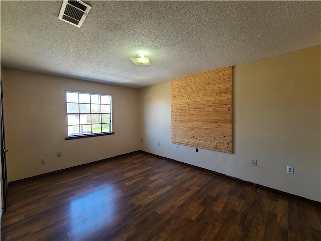 9 Whitney Ave Unit N, Harvey, LA 70058 - empty room featuring dark wood-style flooring, a textured ceiling, and baseboards