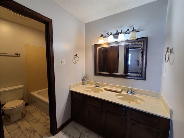 9 Whitney Ave Unit N, Harvey, LA 70058 - full bathroom with marble finish flooring, toilet, baseboards, double vanity, and a bathtub