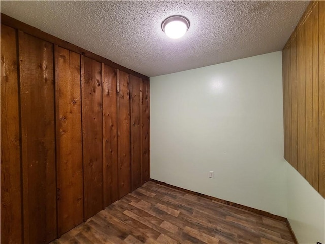 9 Whitney Ave Unit N, Harvey, LA 70058 - empty room with dark wood-style floors and a textured ceiling
