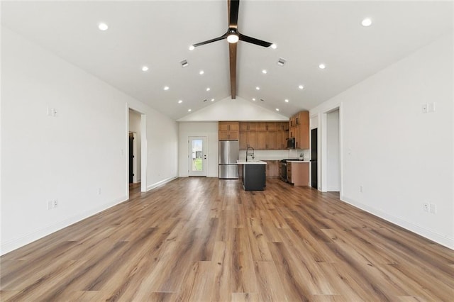 unfurnished living room featuring beam ceiling, visible vents, light wood-style floors, and ceiling fan