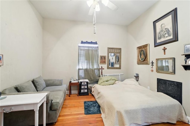bedroom featuring light wood-style flooring and ceiling fan