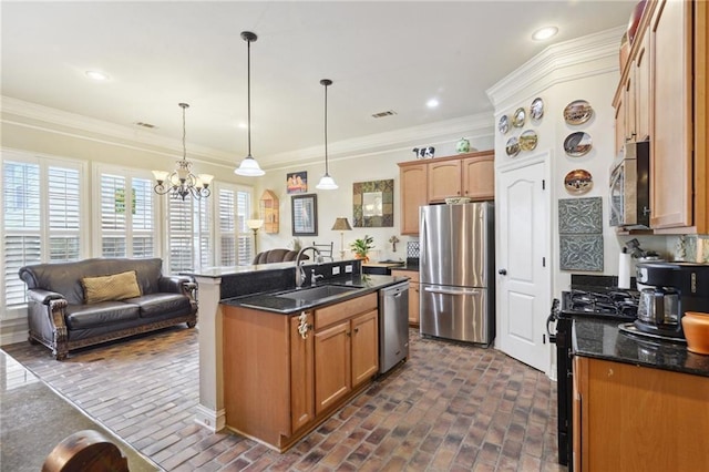 kitchen featuring ornamental molding, appliances with stainless steel finishes, brick floor, and a sink