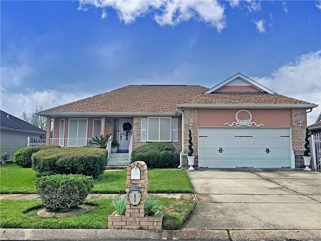 ranch-style home with concrete driveway, brick siding, a garage, and a front lawn