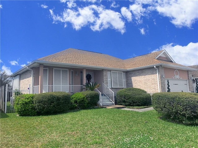 ranch-style house featuring brick siding, a garage, a porch, and a front lawn