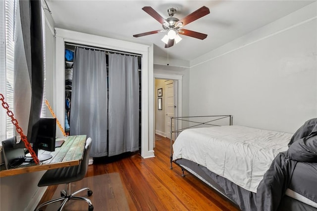 bedroom with wood finished floors and a ceiling fan