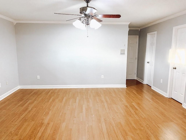 empty room featuring light wood-type flooring, baseboards, ceiling fan, and ornamental molding