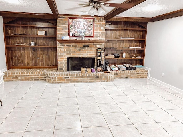 unfurnished living room with tile patterned flooring, built in features, wood walls, and a textured ceiling