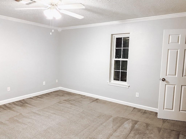 carpeted empty room with baseboards, a textured ceiling, ceiling fan, and crown molding