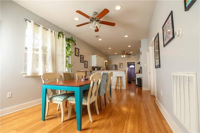 dining room with visible vents, recessed lighting, light wood-style floors, and a ceiling fan