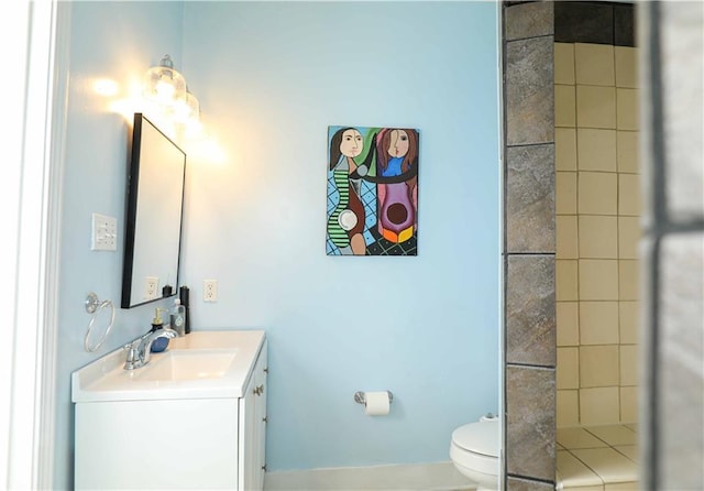 bathroom featuring toilet and vanity