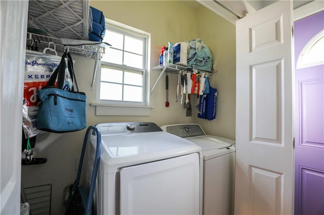 laundry room featuring washer and dryer and laundry area