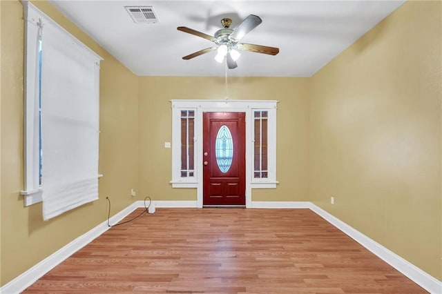 143537 France St, New Orleans, LA 70117 - entryway with light wood-style flooring, a ceiling fan, visible vents, and baseboards