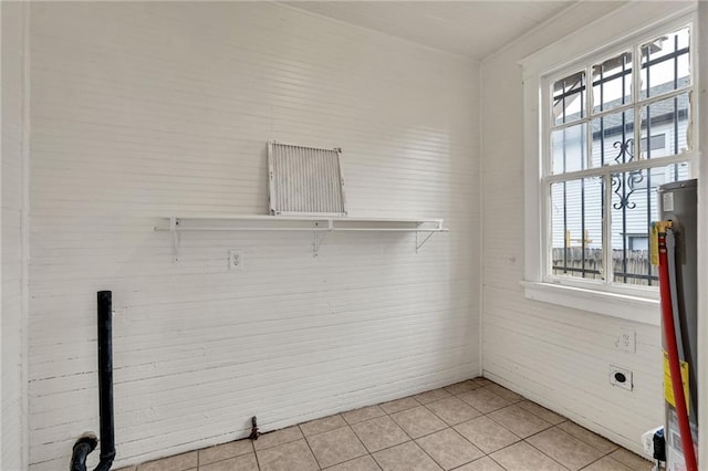 143537 France St, New Orleans, LA 70117 - laundry area featuring gas water heater, laundry area, light tile patterned flooring, and electric dryer hookup