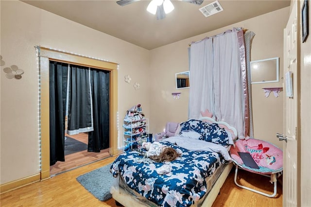 143537 France St, New Orleans, LA 70117 - bedroom featuring access to exterior, visible vents, a ceiling fan, and wood finished floors