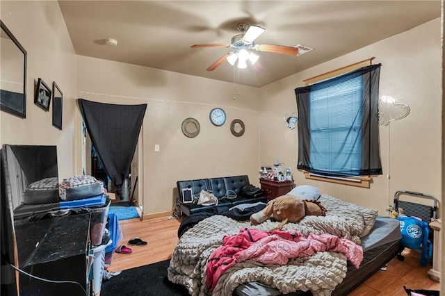 143537 France St, New Orleans, LA 70117 - bedroom featuring wood finished floors and ceiling fan