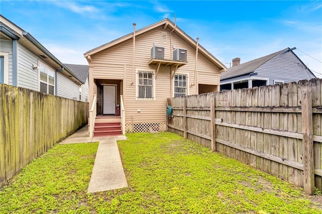 143537 France St, New Orleans, LA 70117 - rear view of property featuring a lawn and fence