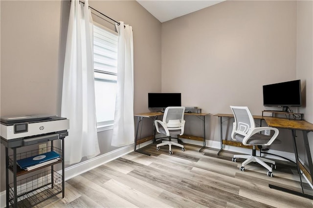 office space featuring wood finished floors and baseboards