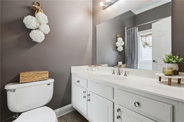 full bath with toilet, curtained shower, tile patterned flooring, baseboards, and vanity