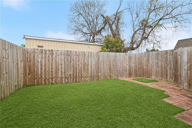 view of yard with a fenced backyard