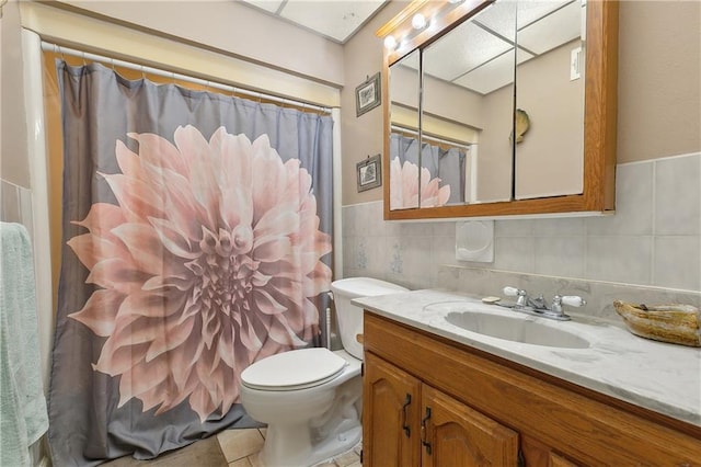 bathroom featuring vanity, tile walls, toilet, and a shower with shower curtain