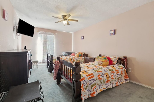 bedroom featuring carpet flooring, a textured ceiling, baseboards, and a ceiling fan