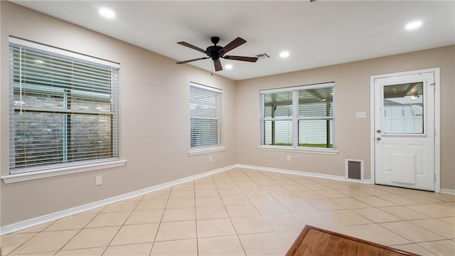 interior space with light tile patterned floors, recessed lighting, baseboards, and a ceiling fan
