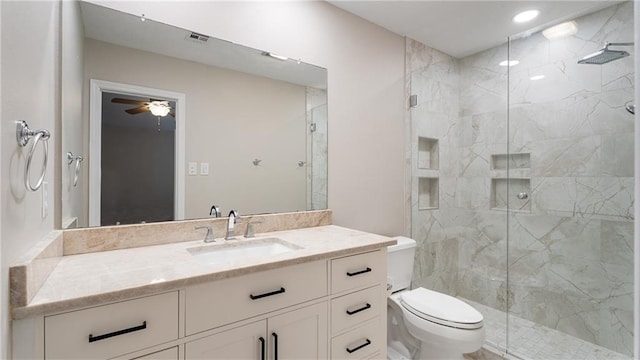 full bath featuring vanity, a ceiling fan, visible vents, a marble finish shower, and toilet