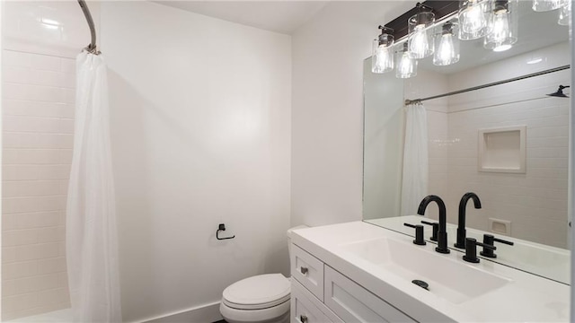bathroom with vanity, a shower with shower curtain, and toilet