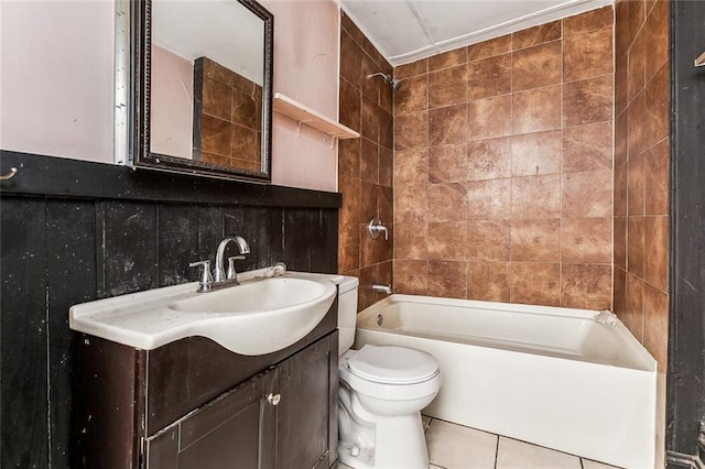 bathroom with vanity, shower / washtub combination, tile patterned floors, toilet, and tile walls