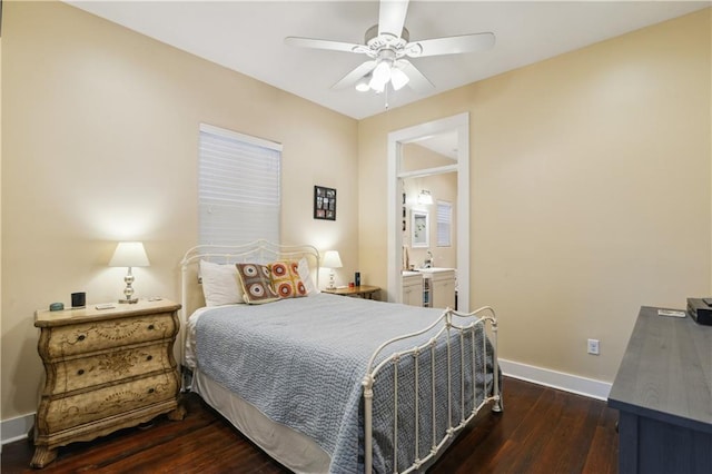 bedroom with hardwood / wood-style floors, baseboards, ensuite bathroom, and ceiling fan