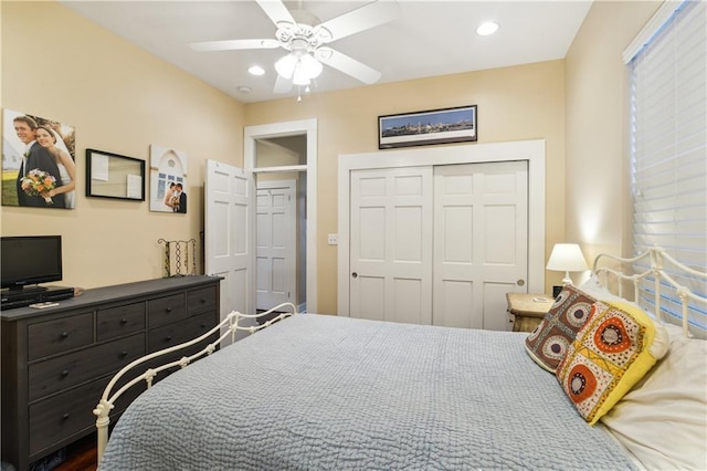 bedroom with a closet, recessed lighting, and a ceiling fan