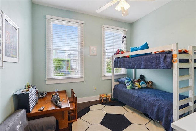 bedroom with baseboards and ceiling fan