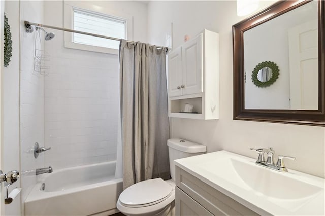 full bath featuring vanity, toilet, and shower / tub combo