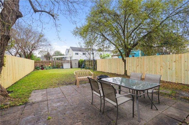 view of patio featuring a fenced backyard and outdoor dining space