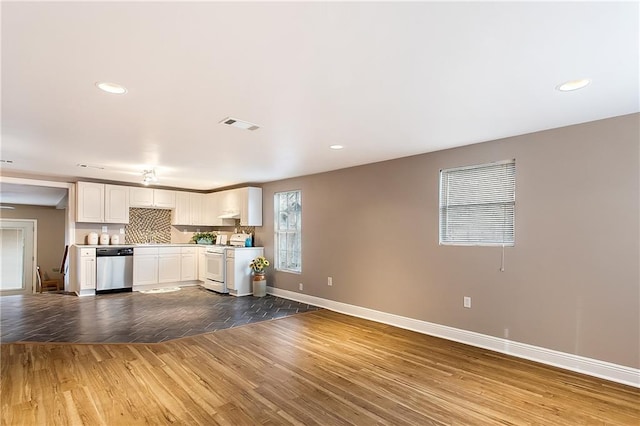 20087 Quincy Ave, Covington, LA 70433 - kitchen with visible vents, stainless steel dishwasher, wood finished floors, white gas range oven, and white cabinets