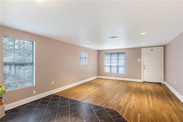 20087 Quincy Ave, Covington, LA 70433 - tiled spare room featuring visible vents, recessed lighting, and baseboards