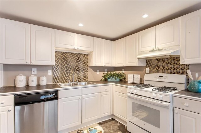 20087 Quincy Ave, Covington, LA 70433 - kitchen featuring white cabinetry, white range with gas stovetop, a sink, under cabinet range hood, and dishwasher