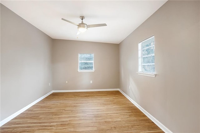 20087 Quincy Ave, Covington, LA 70433 - spare room featuring a wealth of natural light, baseboards, light wood-style floors, and ceiling fan