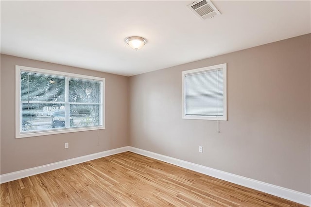 20087 Quincy Ave, Covington, LA 70433 - spare room with visible vents, light wood-type flooring, and baseboards