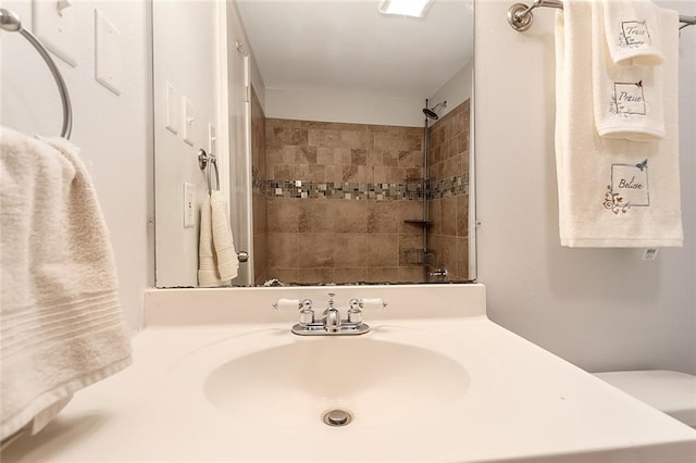 20087 Quincy Ave, Covington, LA 70433 - full bathroom featuring toilet, vanity, and a shower