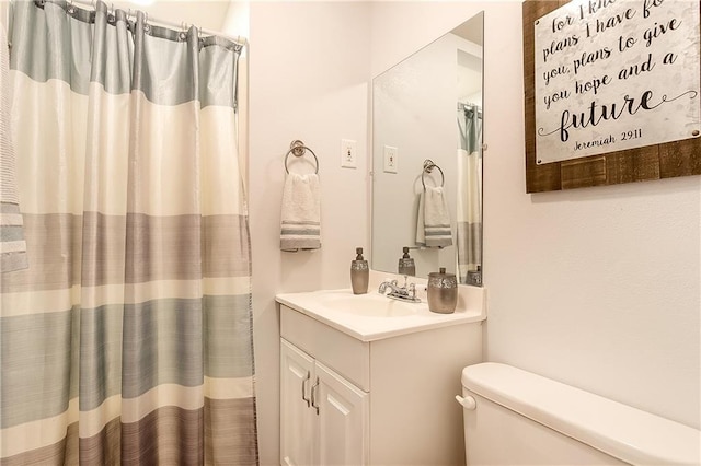 20087 Quincy Ave, Covington, LA 70433 - bathroom featuring vanity, toilet, and a shower with curtain