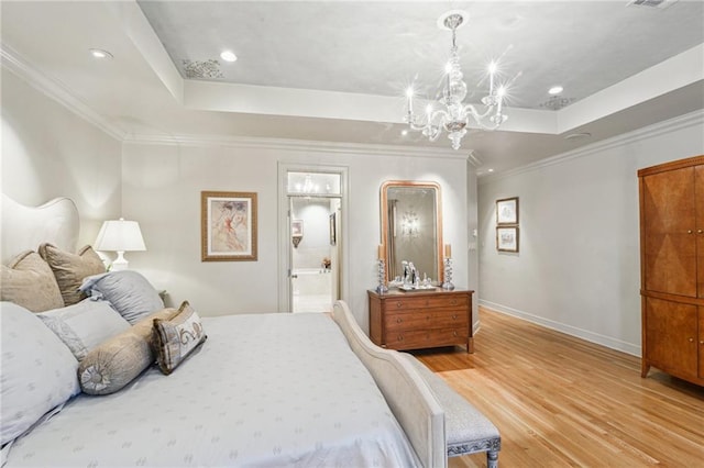 bedroom featuring a raised ceiling, light wood-style flooring, a notable chandelier, and baseboards