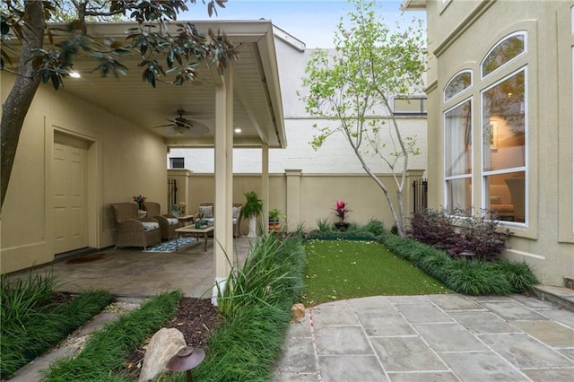 view of patio featuring a ceiling fan